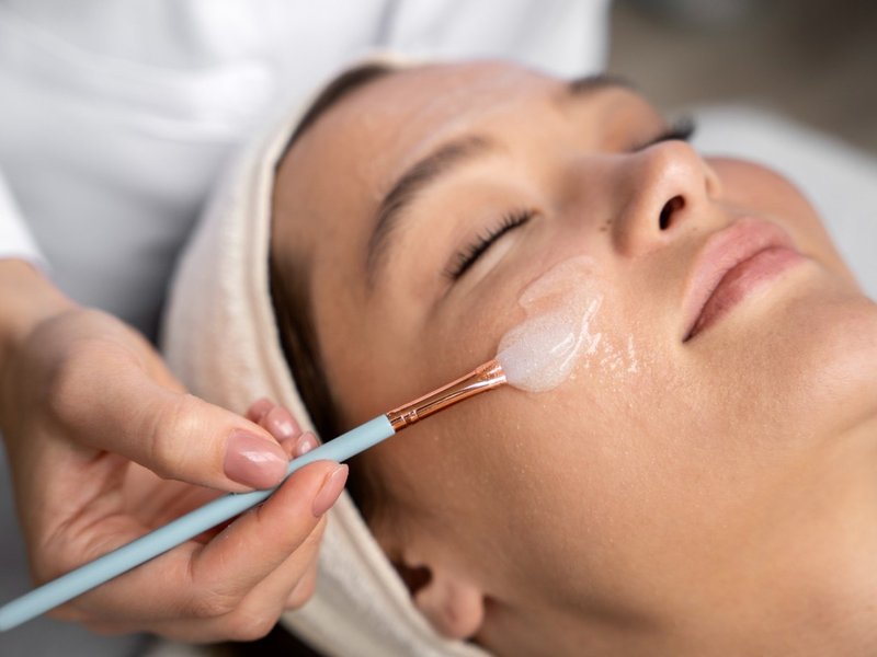 Chemical peel being applied during a facial treatment